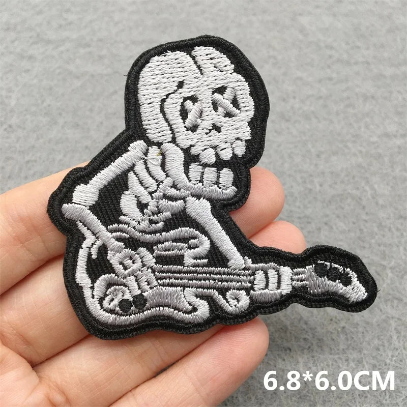 Black and silver music embroidered patch featuring a skeleton playing electric guitar for clothes stickers diy jacket jeans headset