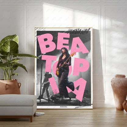 A framed black and white rock singer poster with bold pink text for modern living room wall art decor