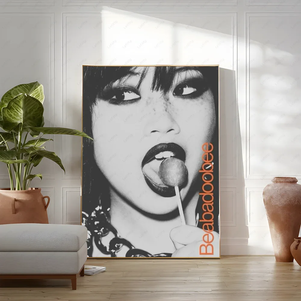 Black-and-white framed modern graphic poster of beabadoobee with bold orange text for living room wall art