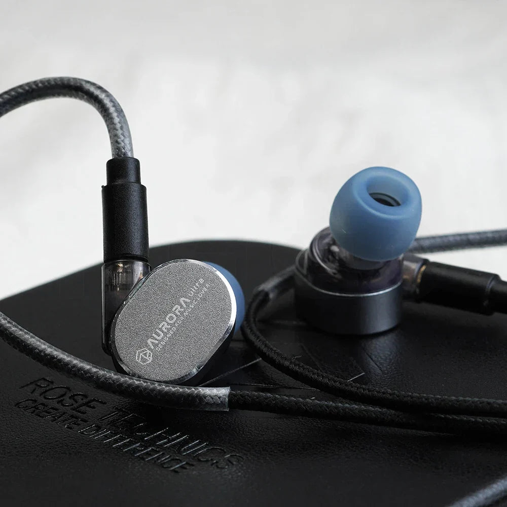 Silver aurora in-ear monitors with blue silicone eartips and black braided cable for roseselsa aurora ultra dual-driver hybrid type c dac