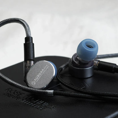 Silver aurora in-ear monitors with blue silicone eartips and black braided cable for roseselsa aurora ultra dual-driver hybrid type c dac