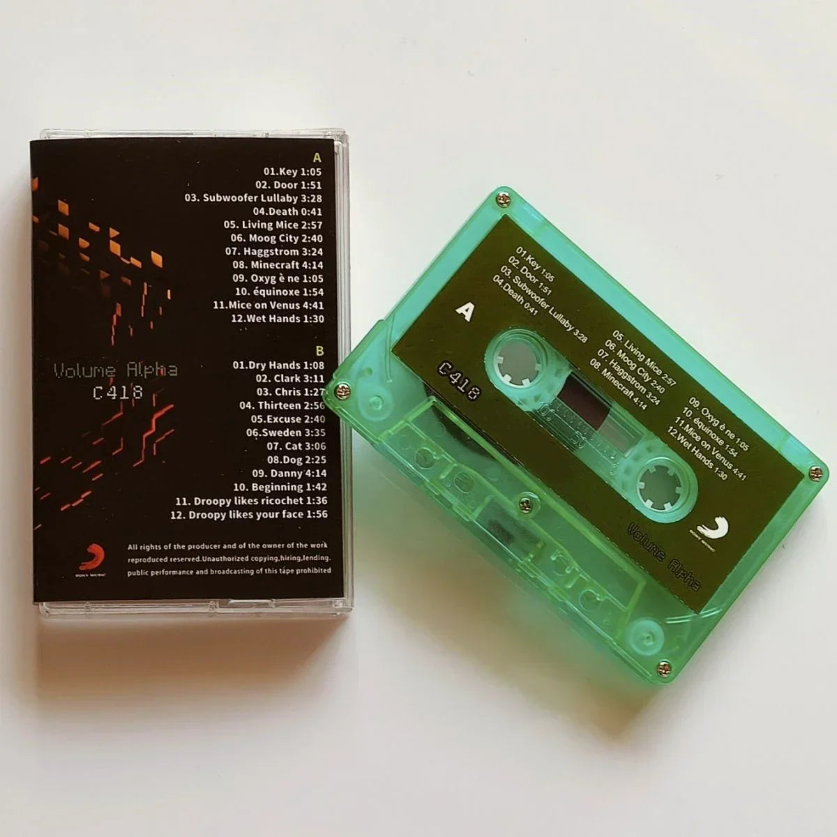 A translucent green cassette tape with white text label in clear case for sandbox game daniel rosenfeld music album cassettes cosplay