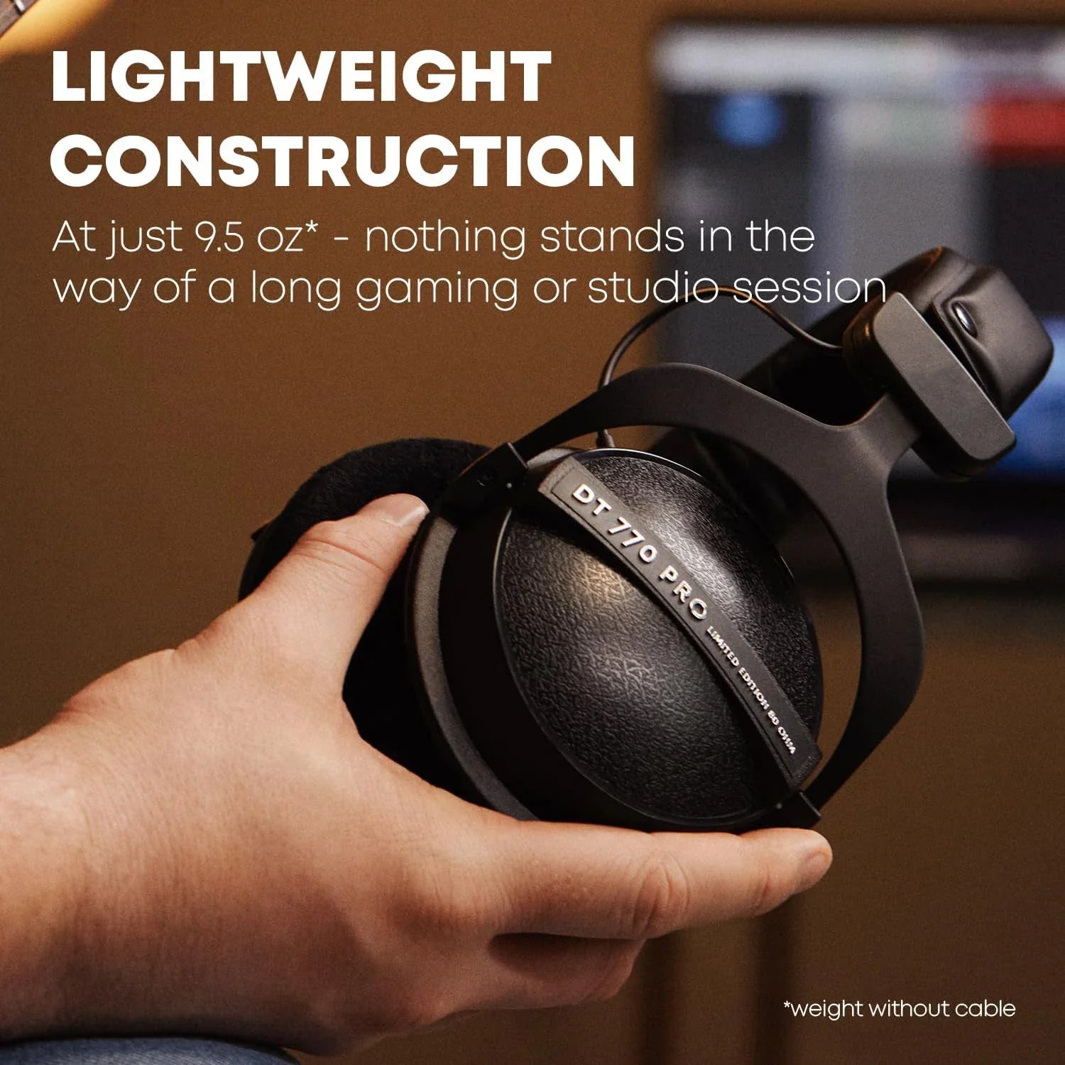 Black sanpusen dt770 pro over-ear monitor closed-back headphones with matte finish and textured earcups for studio recording mixing