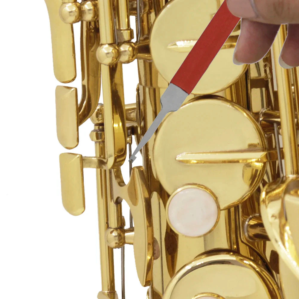 Red-handled saxophone needle spring hook double hooks design used on a golden brass saxophone key cleaner accessory