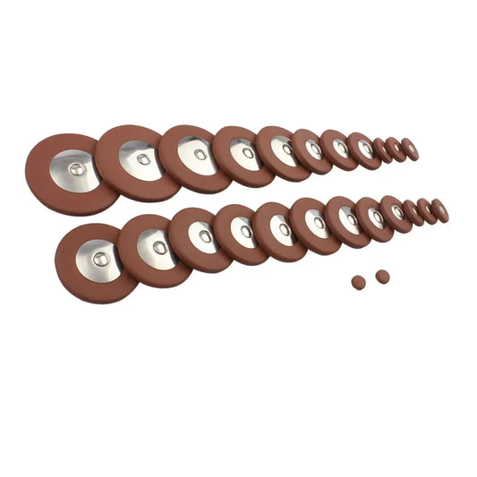 Brown rubber-coated saxophone pads with metallic centers arranged for alto soprano sax button leather pads use