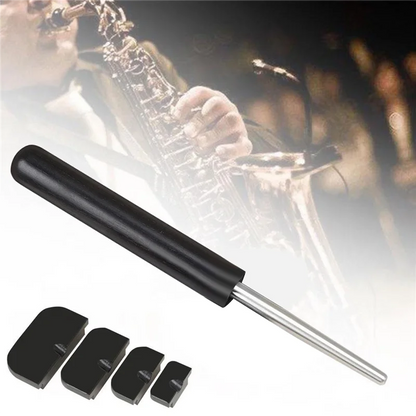 Black cylindrical saxophone sound hole deformation tool with four matching black plastic caps for repair use