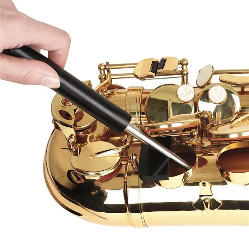Black-handled saxophone sound hole deformation tool with metallic tip for precise hole deformation repair and maintenance