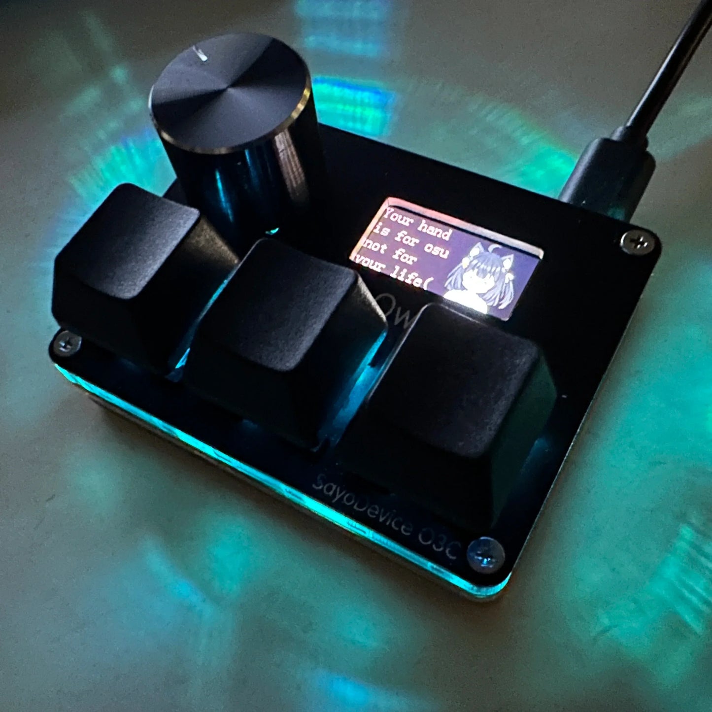 Black sayodevice rapid trigger music game keyboard with matte finish, three square keys, and cylindrical volume knob
