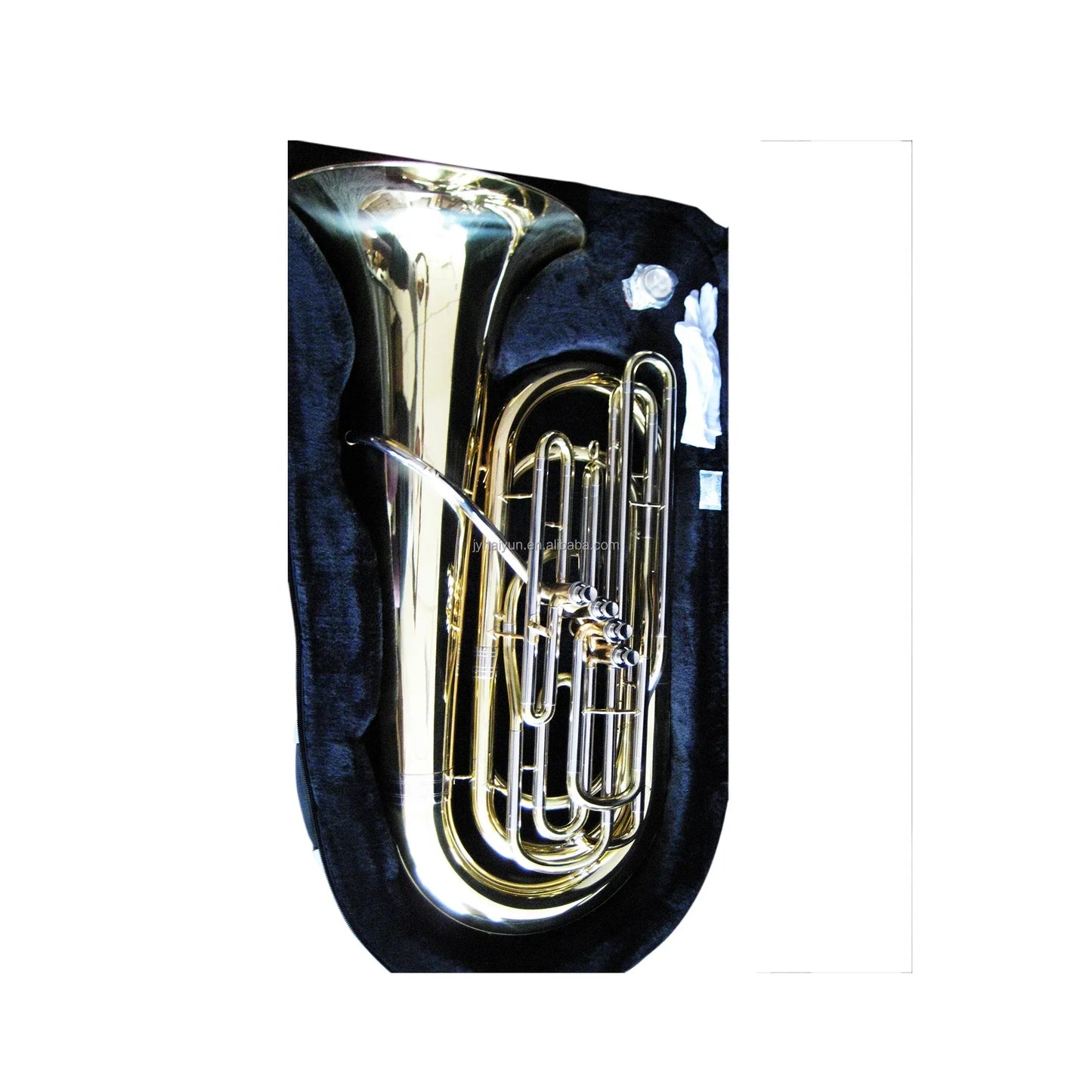 Shiny seasound oem jytu0745 gold lacquer tuba with pistons nestled in a black velvet case
