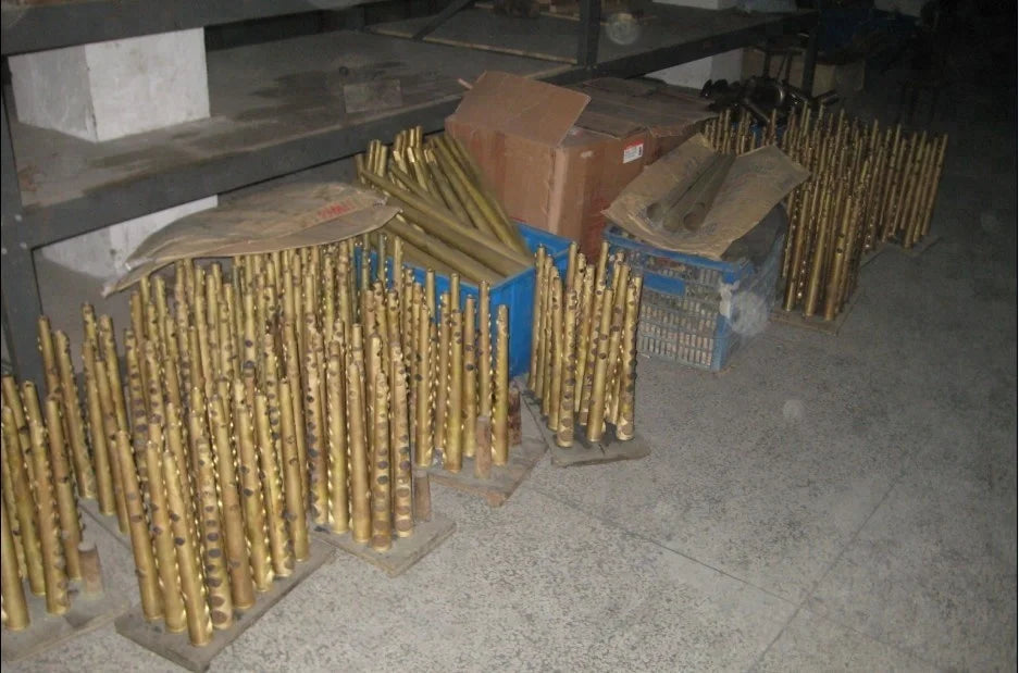 Golden brass drill bits arranged on wooden blocks for seasound oem professional silver soprano saxophone jyss111s maintenance