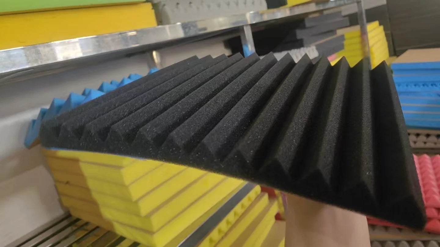 Black ribbed self-adhesive soundproof foam panels with eggcrate acoustic wall texture for noise reduction and studios