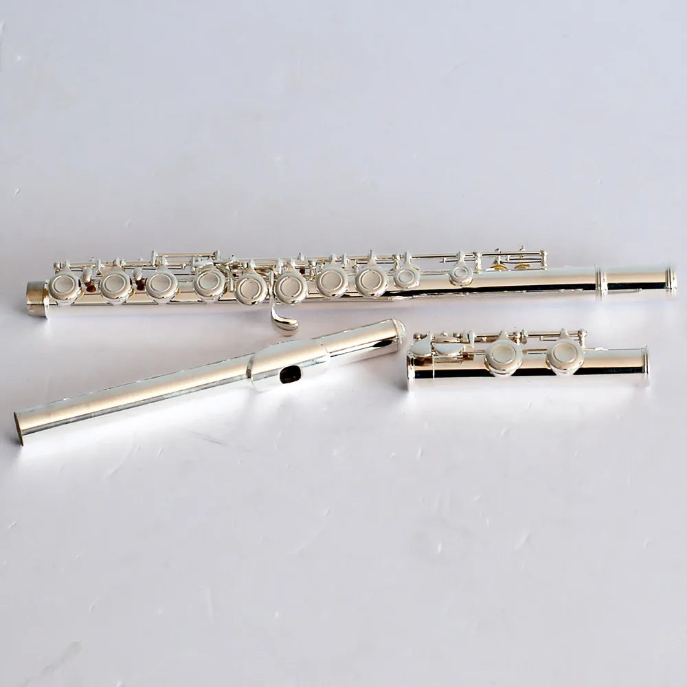 Silver plated high quality flute with 16 17 hole closed design shown fully assembled and disassembled with sleek finish
