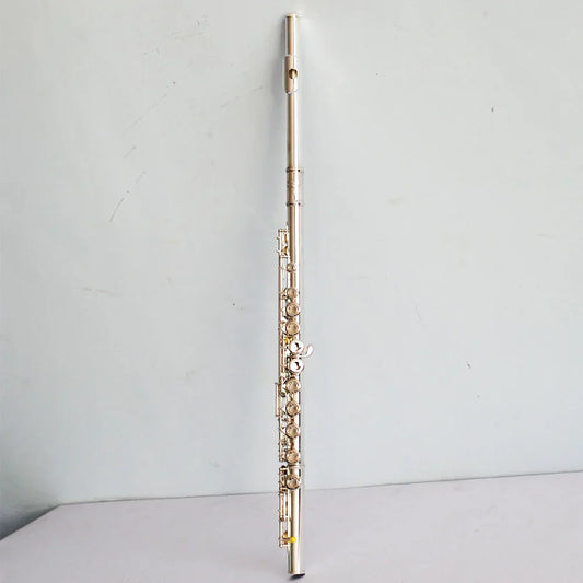 A high quality silver plated flute with 16 17 hole closed keywork featuring polished metallic finish for playing instruments