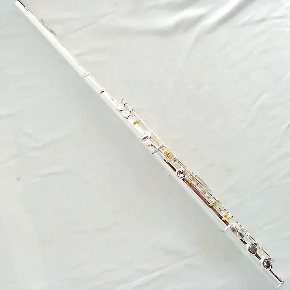 Silver plated high quality flute with 16 17 hole closed keywork and gold accents ideal for reed glove cleaning