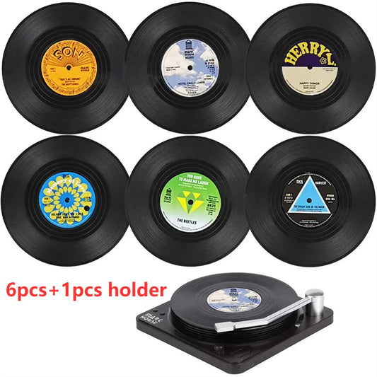 Set of six black vinyl coasters with colorful vintage labels and a matching record player holder for drinks use