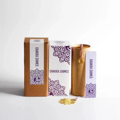 Wooden cylindrical seventh chord wind chime with gold ring and pink string in purple mandala boxes for meditation yoga japanese use