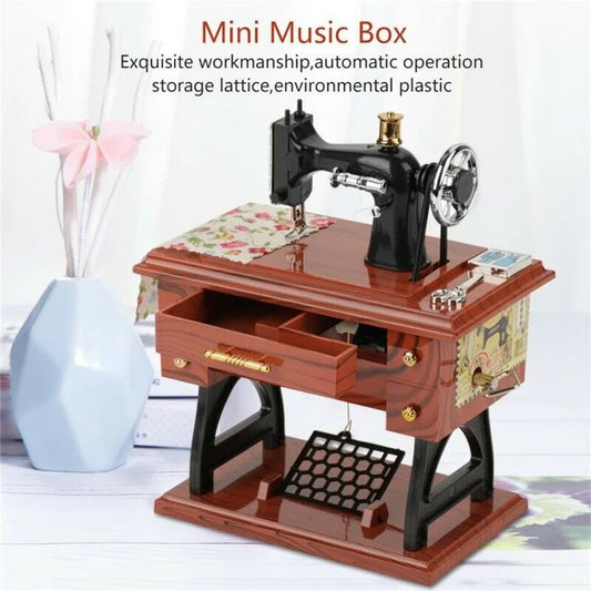 Black and gold sewing clockwork music box with floral fabric on wooden base mini vintage retro home decoration