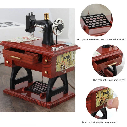 Red wooden clockwork music box designed as vintage retro sewing machine with black metal and brass details
