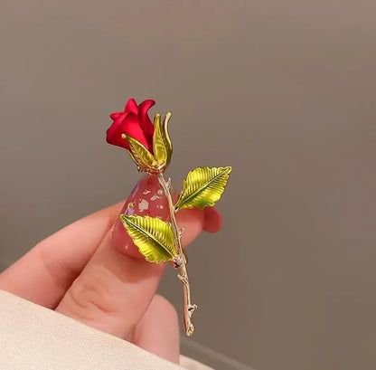 Delicate red rose brooch with gold toned stem and translucent pink resin base for women music accessory clothing decoration