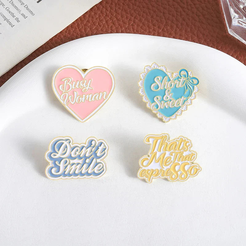 Pink heart-shaped sweet enamel pin with gold trim and white busy woman script for pop music singer smile brooches clothes