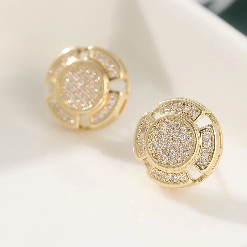 Gold-toned stud earrings with circular cut-out design and clear crystals for men and women punk rock style