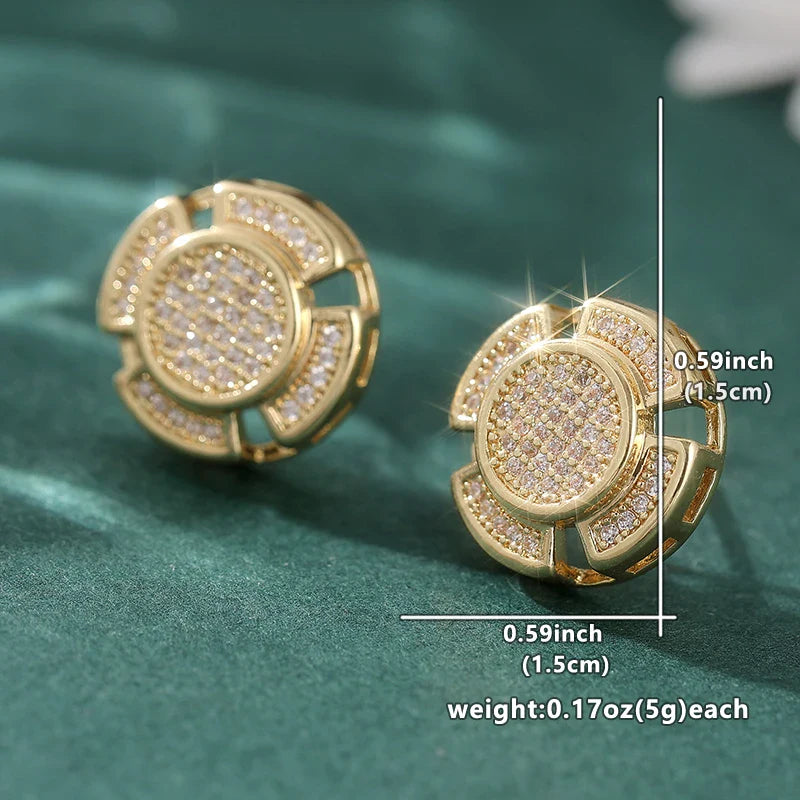 Gold-toned stud earrings with circular flower-like design and clear cubic zirconia in simple dazzling style for men and women