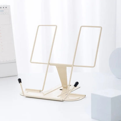Cream-colored metal reading stand with adjustable height and black rubber feet foldable and portable music score stand