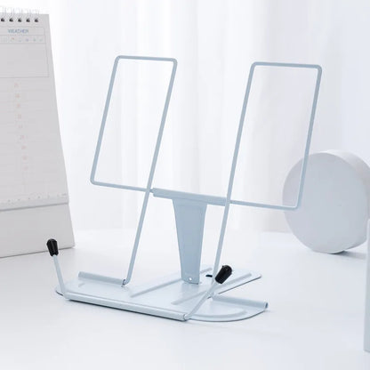 Minimalist white metal reading stand with adjustable arms and black rubber feet for portable music score use