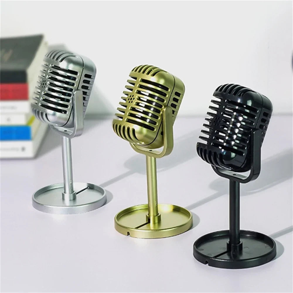 Three vintage-style desktop vocal microphones in silver gold and black metallic finishes for simulation classic retro live performanc karaoke