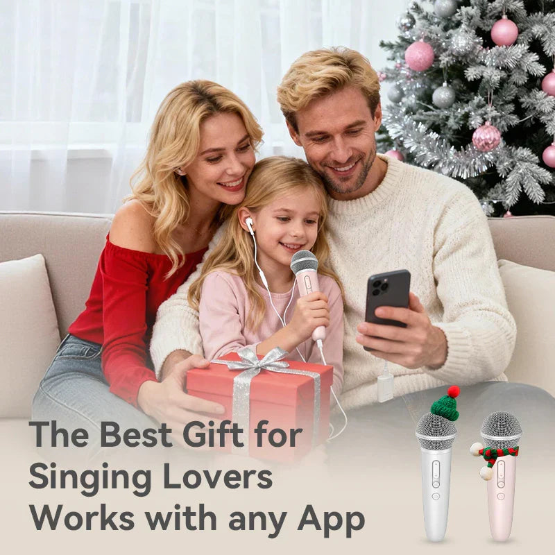 Pink and white wireless handheld record microphone with earphone feedback karaoke and festive holiday decorations
