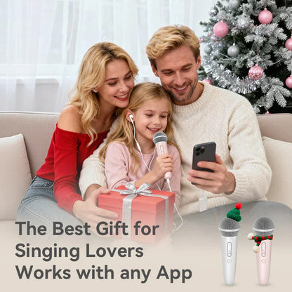 Pink and white wireless handheld record microphone with earphone feedback karaoke and festive holiday decorations
