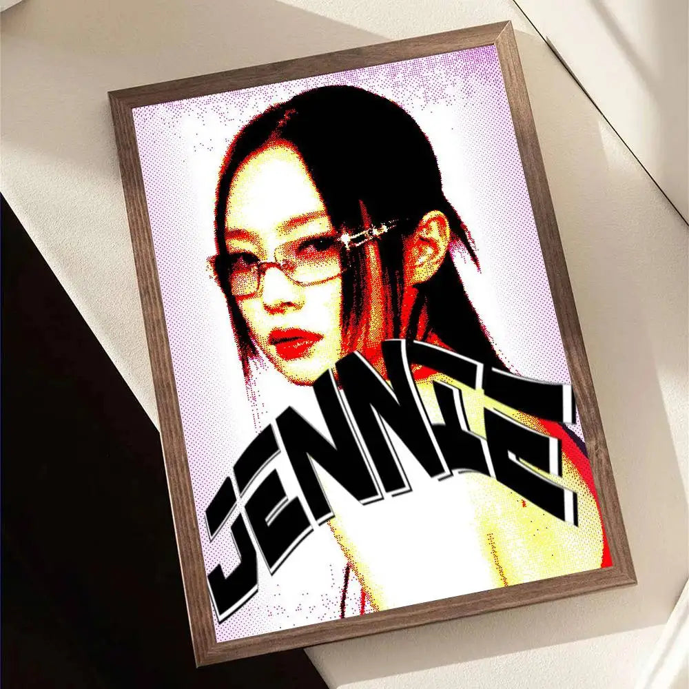 A framed pop art portrait of Jennie with bold black and white lettering in vibrant reds and yellows for wall decor