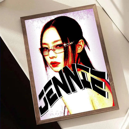 A framed pop art portrait of Jennie with bold black and white lettering in vibrant reds and yellows for wall decor