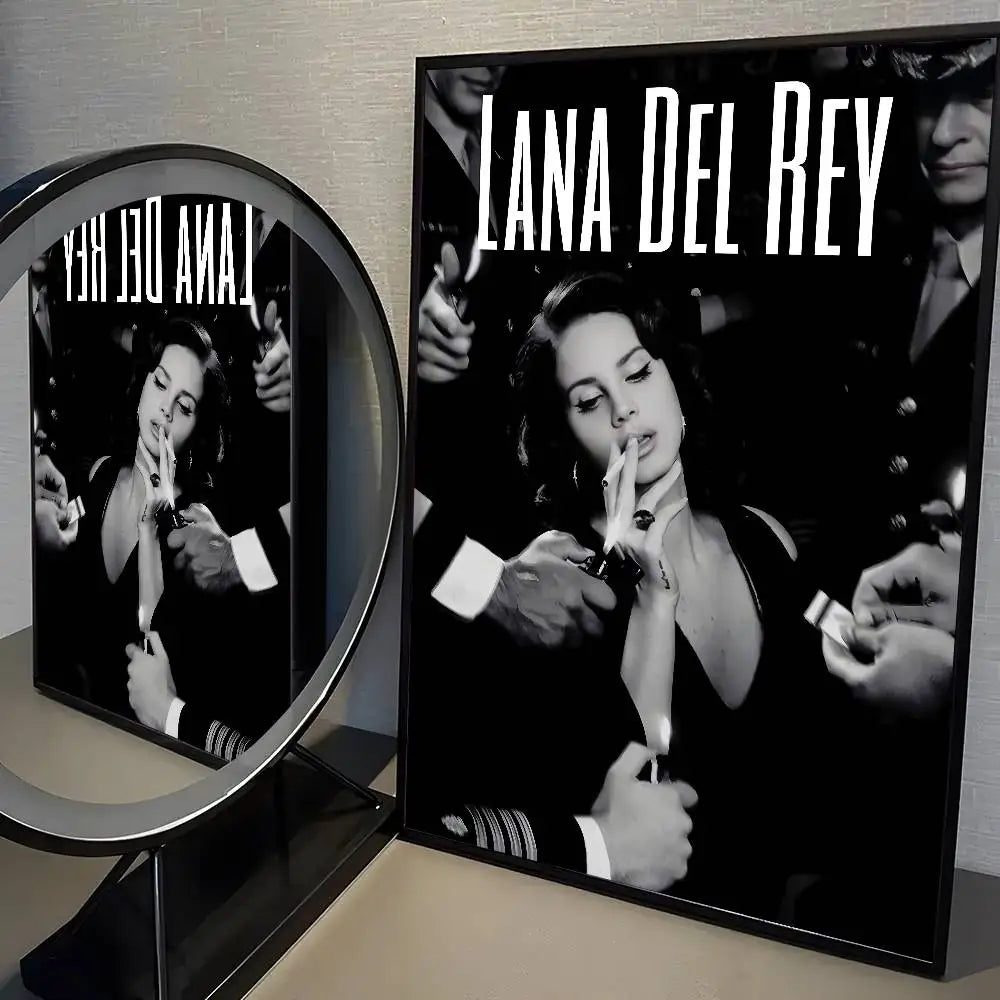 Black-framed modern graphic lana del rey poster featuring black and white photo and bold white text for wall decor
