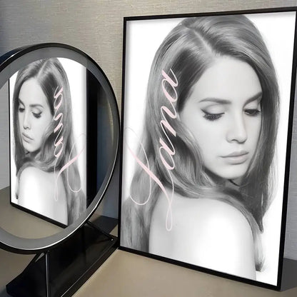 Black-framed black-and-white modern graphic lana del rey poster with light pink cursive name for home decor wall art