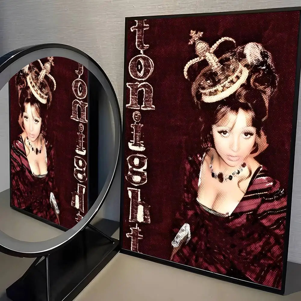 A framed modern graphic poster of a woman in a dark red velvet dress with gold headpiece for living room decor