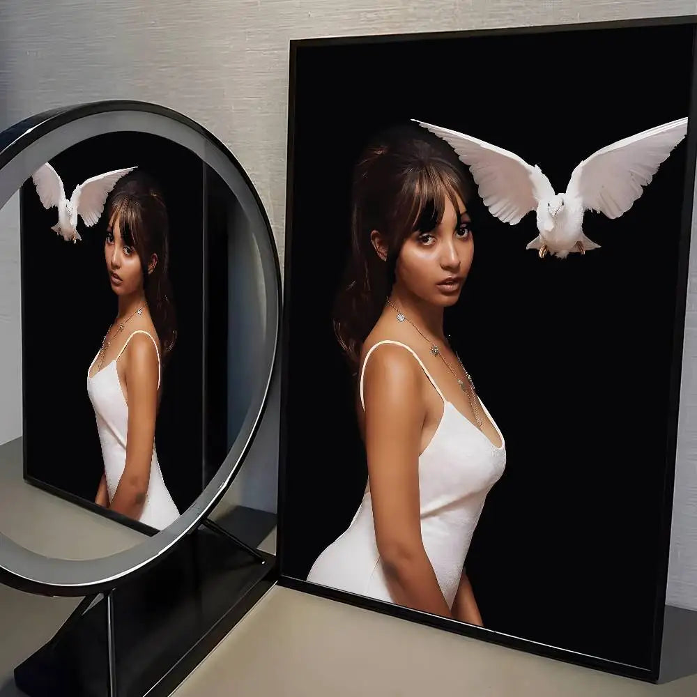 Framed modern graphic poster of woman in white dress with white dove on black background for living room decor