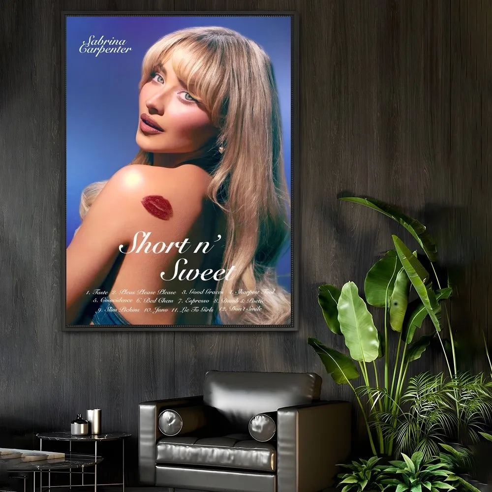 A modern graphic framed poster of singer Sabrina Carpenter with blonde hair and red lipstick mark on blue background