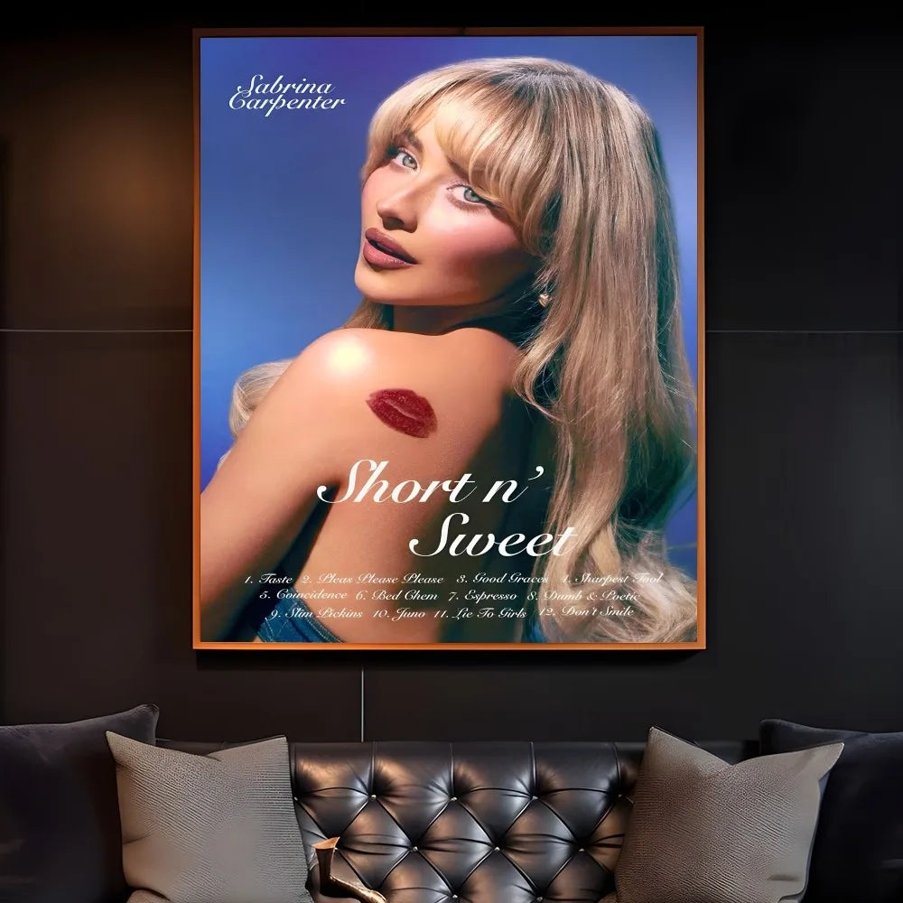 A modern graphic framed poster of singer sabrina carpenter with blonde hair and red lipstick mark on blue background for home decor