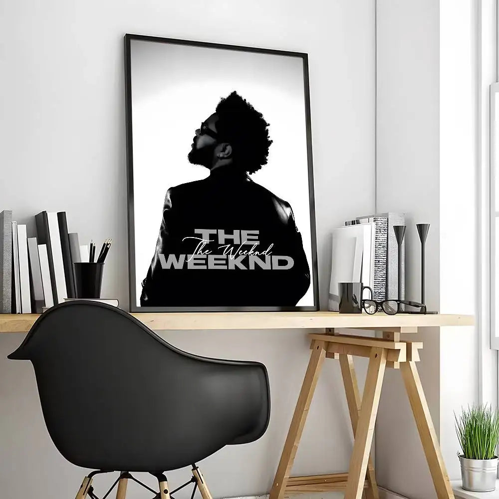 Black-framed modern graphic poster of the weeknd monochrome silhouette with bold white lettering for living room decor