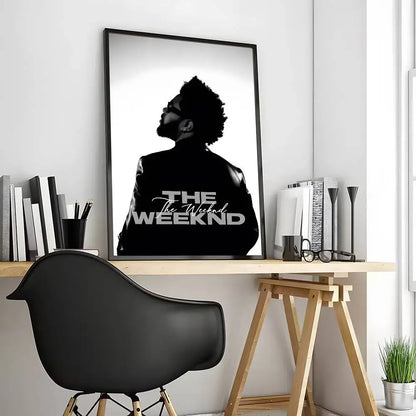Black-framed modern graphic poster of the weeknd monochrome silhouette with bold white lettering for living room decor