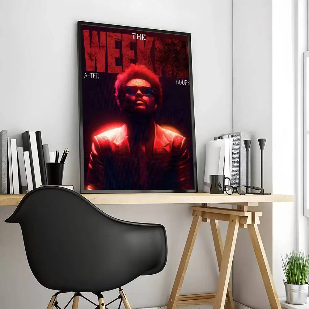 A framed poster of The Weeknd in a red suit with modern graphic text, ideal for living room wall decoration