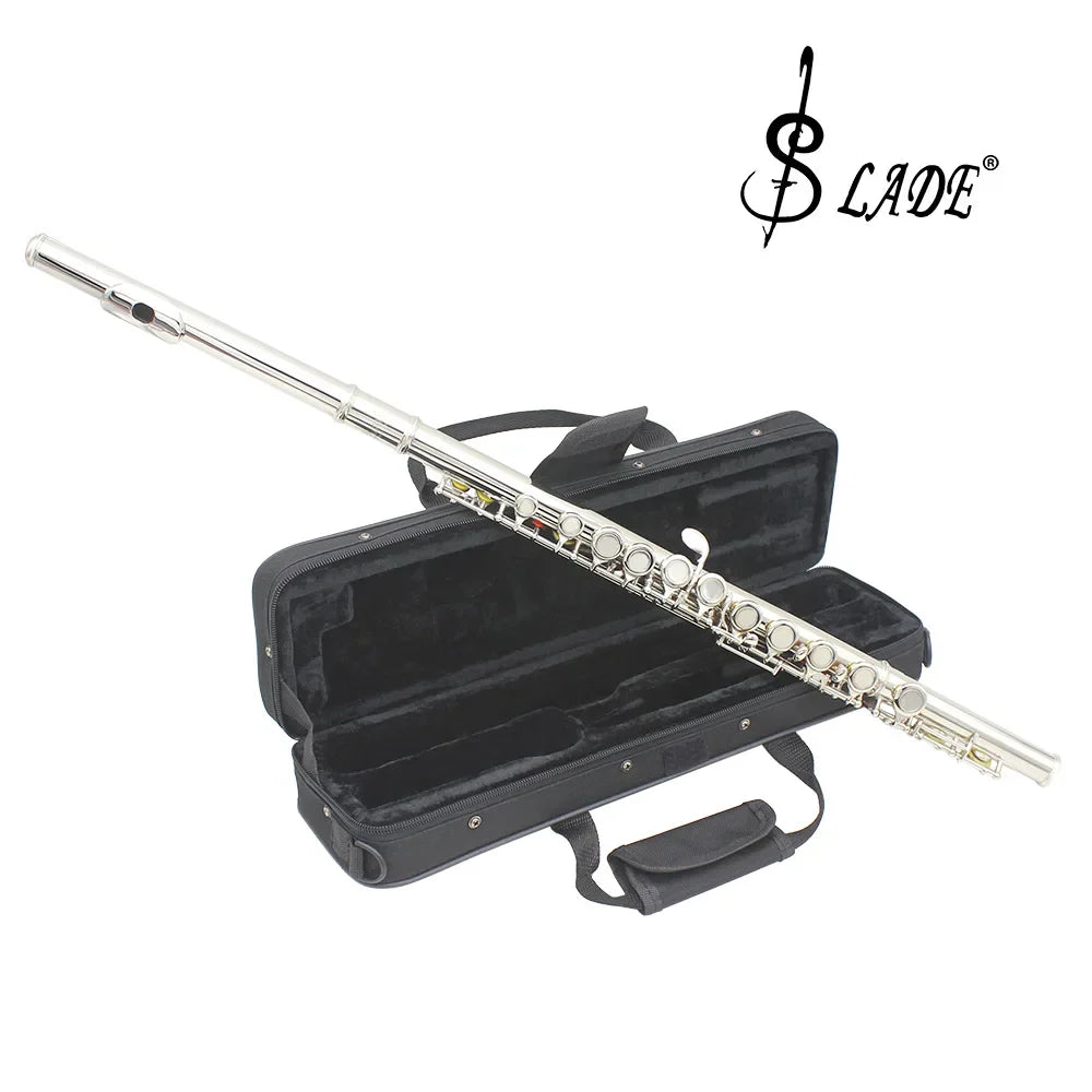 Silver professional transverse flute with closed open holes and polished finish resting on black case with box cleaning cloth