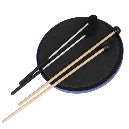 Black circular drum pad with blue rim and two wooden slade pair marimba drumsticks resting on top
