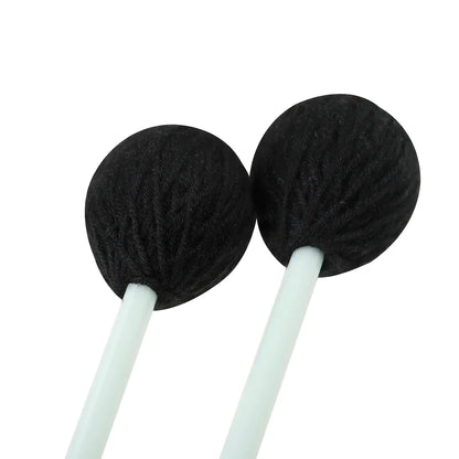 Slade pair marimba drumsticks with black fuzzy rubber heads and white handles for percussion instrument use