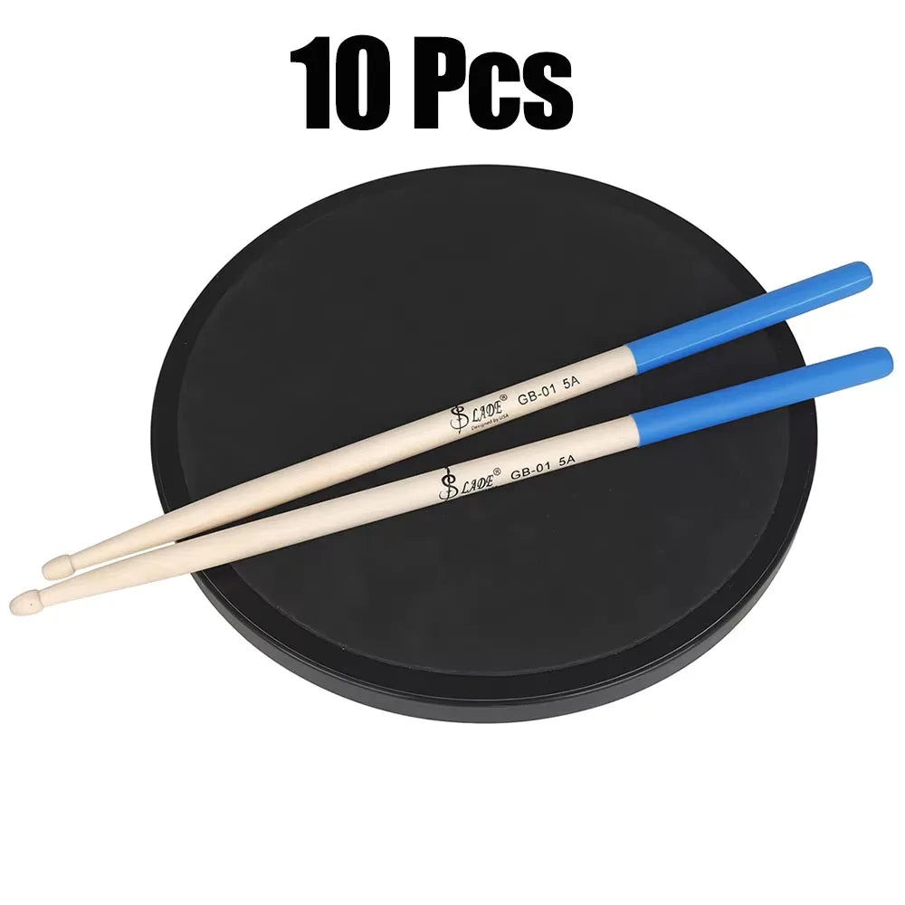 A pair of light-colored maple drumsticks professional with blue handles resting on a black practice pad for percussion accessories