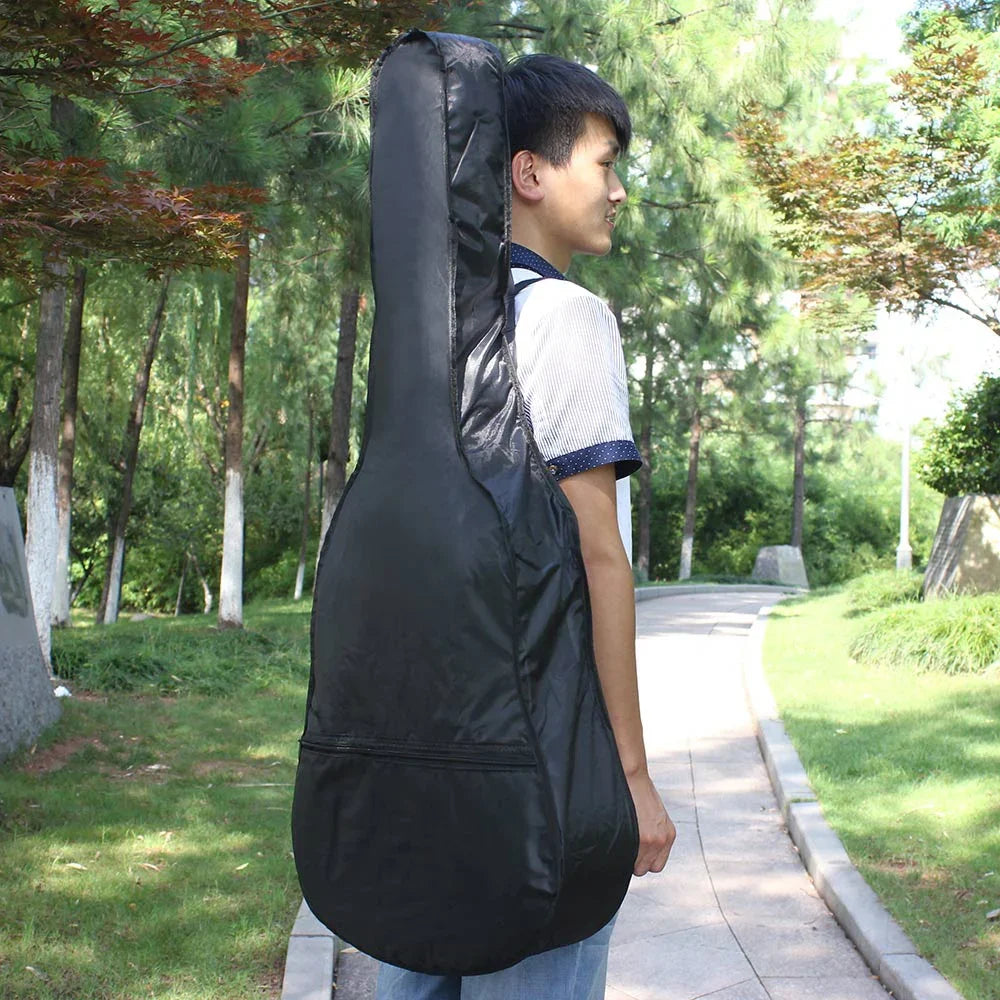 Black nylon classical acoustic guitar carry bag with zipper closure and reinforced shoulder strap backpack design