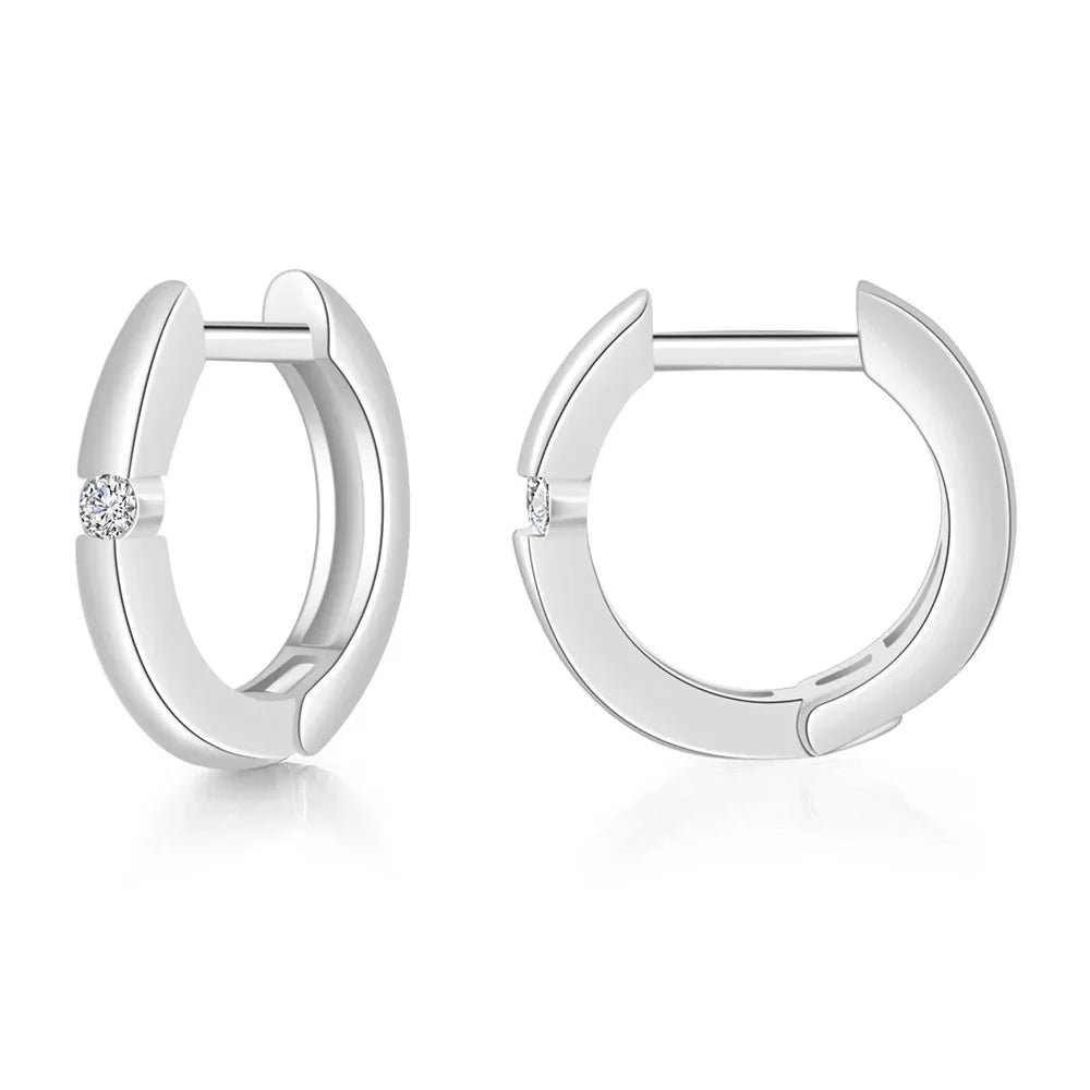 Silver huggie hoop earrings for women with a single round diamond on the outer curve in gold color hip hop style