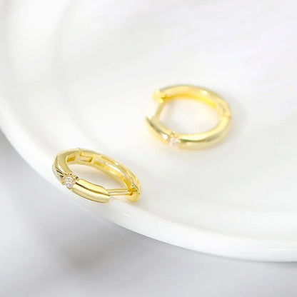 Small gold hoop earrings for women with subtle textured design and zircon diamond accent hip hop jewelry clip