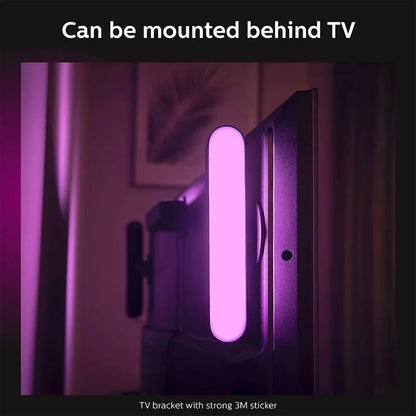 A sleek purple smart led symphony sound control pickup light strip mounted behind a tv with 3m adhesive bracket